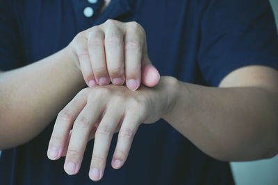 Midsection of couple hands