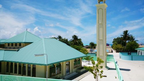 High angle view of mosque against cloudy sky