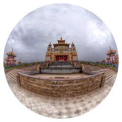 Built structure against cloudy sky