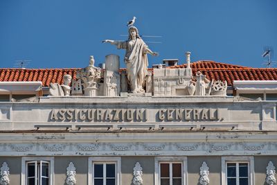 Low angle view of building against clear blue sky