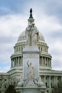 Low angle view of statue against sky