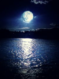 Reflection of trees in water at night