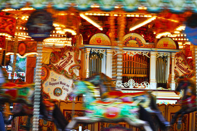 Illuminated carousel in amusement park