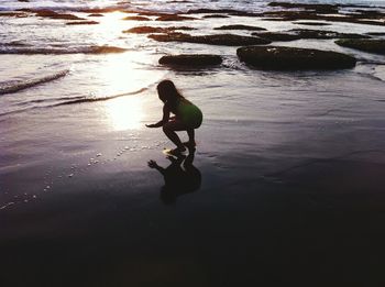 Silhouette boy on beach