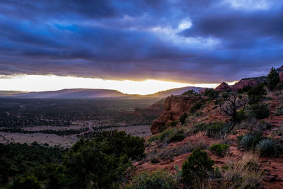 Scenic view of landscape against dramatic sky