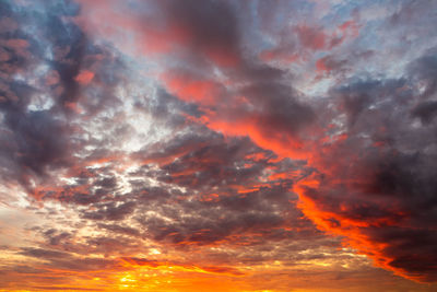 Low angle view of dramatic sky during sunset