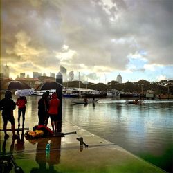 View of calm lake against cloudy sky