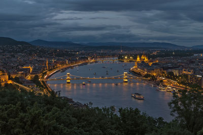 High angle view of illuminated bridge over river against sky