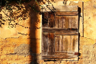 Old rustic wooden door of abandoned house