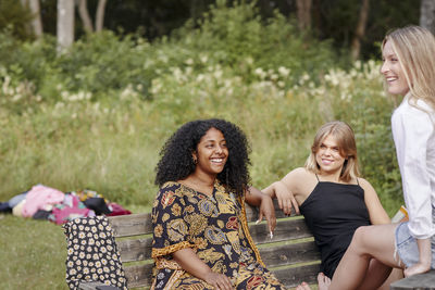 Group of friends resting in forest