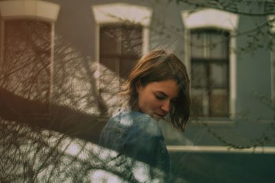 Portrait of young woman looking down