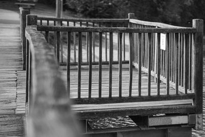 Empty bench in water