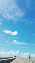 Low angle view of highway against blue sky