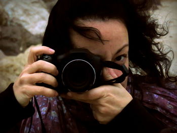 Close-up of woman photographing outdoors
