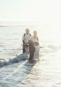 Full length of couple at beach