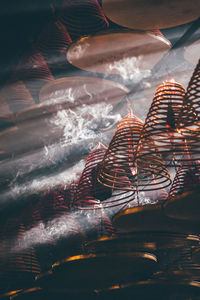 Close-up of amusement park ride at night