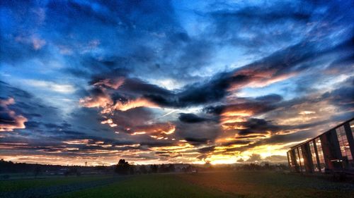 Scenic view of dramatic sky over city