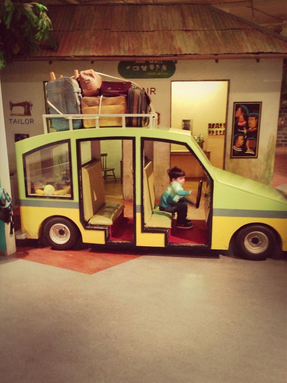 indoors, architecture, built structure, no people, technology, table, absence, transportation, home interior, wall - building feature, house, retro styled, land vehicle, flooring, day, mode of transport, old-fashioned, chair, toy, stationary