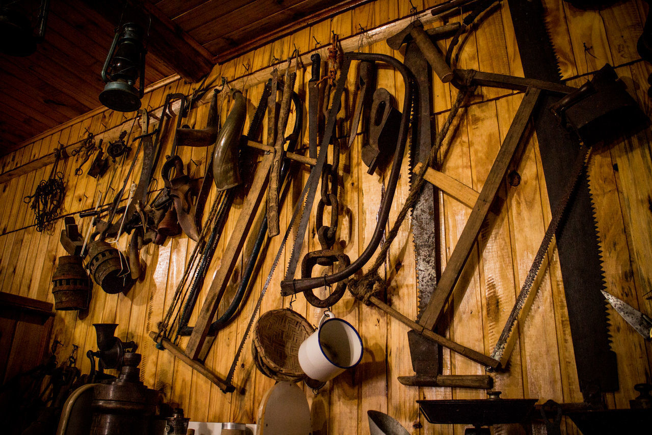 CLOTHES HANGING ON WOOD IN SHELF