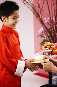 Father greeting son during festival