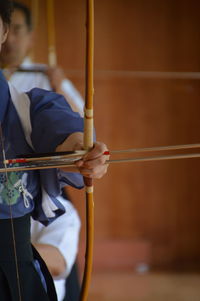 Close-up of hand holding umbrella