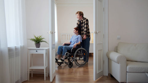 People sitting in corridor of building