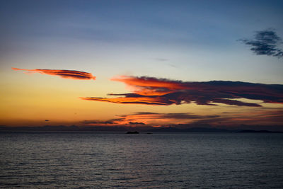 Scenic view of sea against romantic sky at sunset