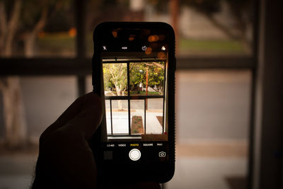 Close-up of hand using mobile phone
