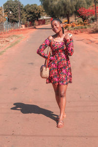 Full length of young woman standing on land