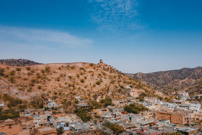 Scenic view of townscape against sky