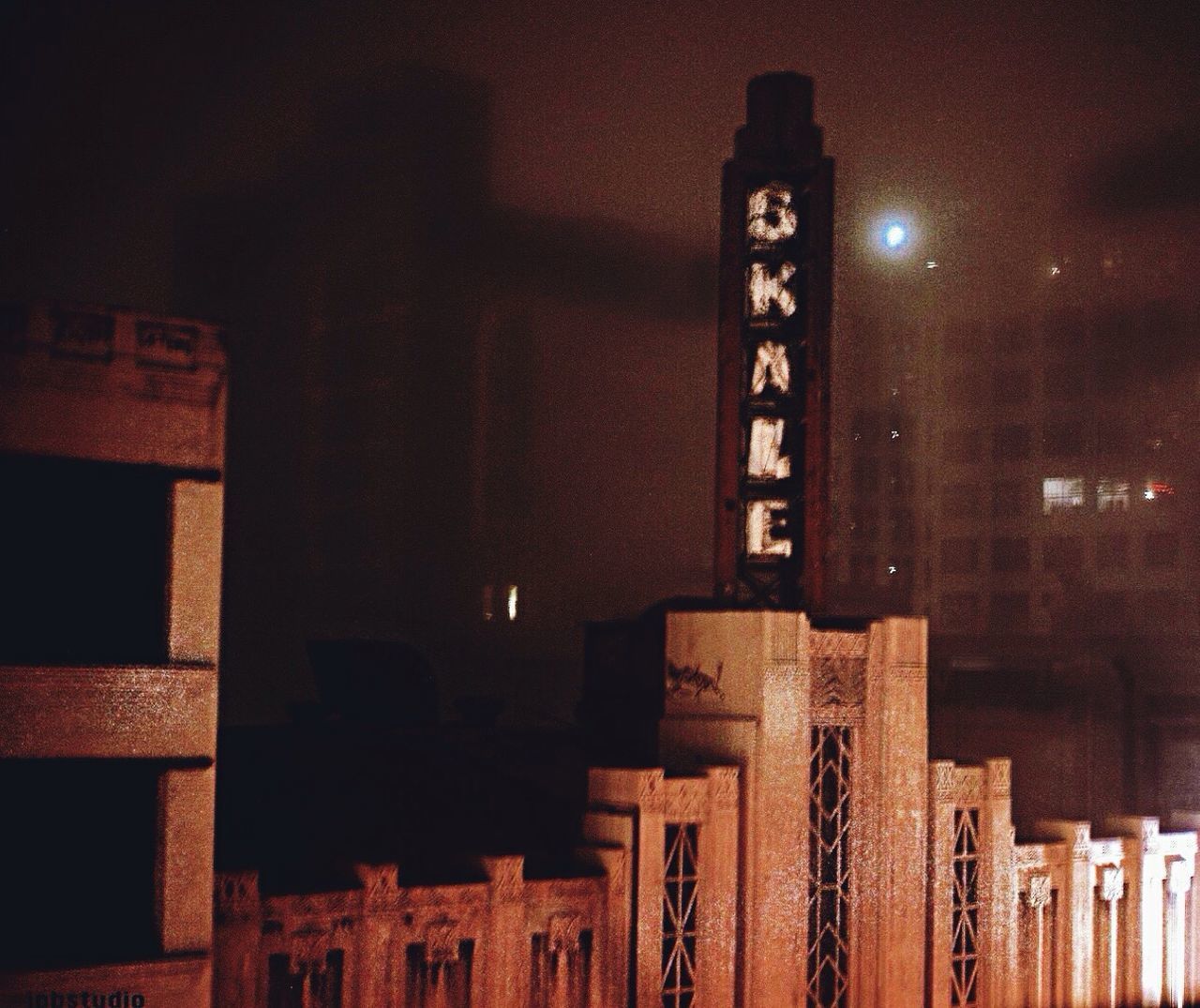 Buildings in foggy weather at night