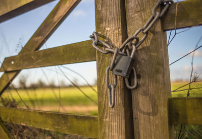 Close-up of wooden fence on field