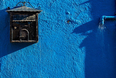 Close-up of blue door of building