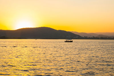 Scenic view of sea against sky during sunset