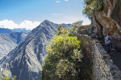 Man hiking up the inca trail path close to machu picchu