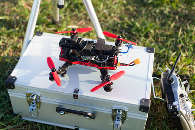 High angle view drone on box over field