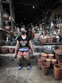 Portrait of woman sitting at market