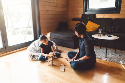 High angle view of man sitting at home