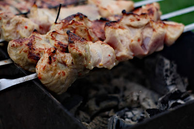 High angle view of meat on barbecue grill