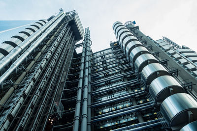 Low angle view of buildings against sky in city