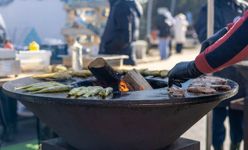 Midsection of person preparing food