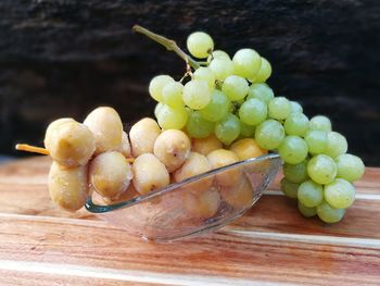 Close-up of grapes on table