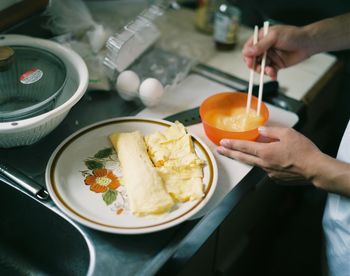 Midsection of man preparing food in kitchen