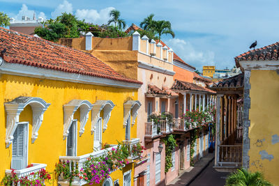 Houses in town against sky