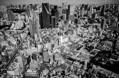 High angle view of crowd and buildings in city