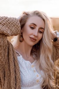 Portrait of smiling young woman looking away