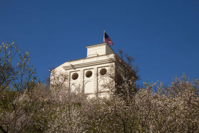 Low angle view of building against clear blue sky