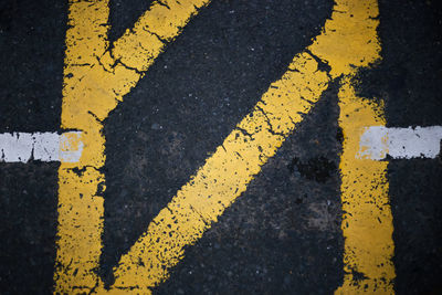 High angle view of arrow sign on road