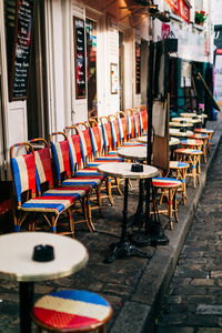 Empty chairs and tables in restaurant