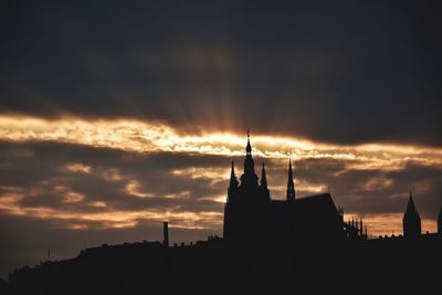Silhouette of building against sky during sunset